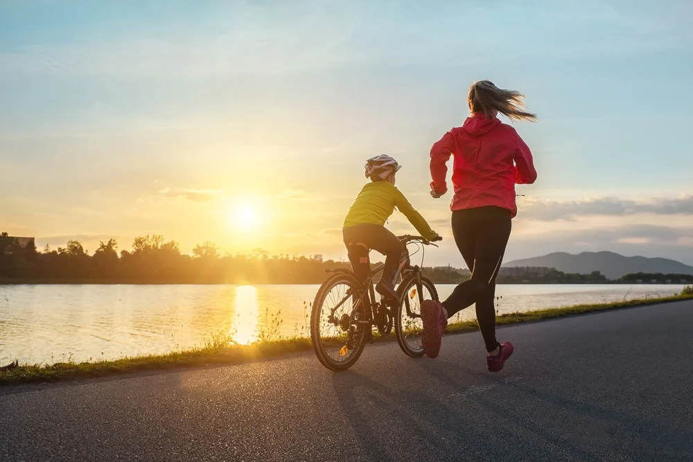 happy,mother,and,son,go,in,sports,outdoors.,boy,rides